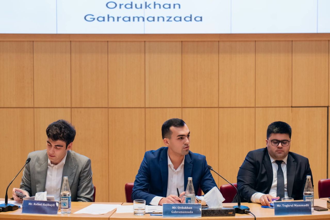 Ordukhan Gahramanzada seated on a discussion panel