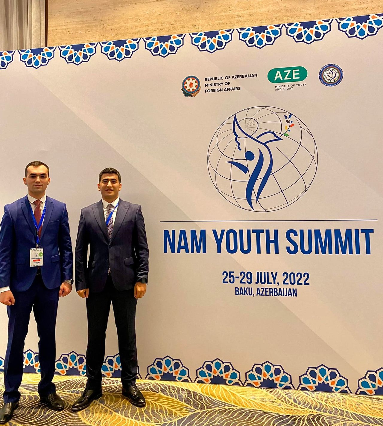 Ordukhan Gahramanzada in front of the NAM Youth Summit backdrop